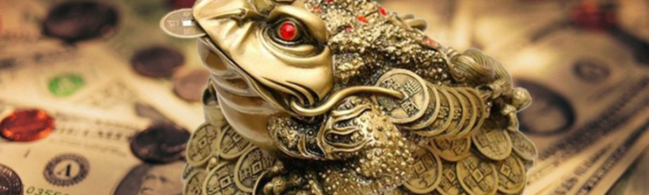 Eine Kröte mit einer Münze im Mund - ein Talisman, der Geld anzieht
